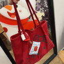 Bolso de lona Hello Kitty rojo con detalle de moño y estampa kawaii