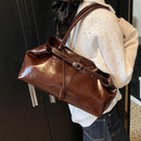Cartera vintage estilo doctor en cuero encerado marrón usada al hombro