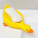 Jabonera pato autodrenante amarilla con diseño tierno y jabón apoyado sobre la base