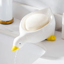 Jabonera pato autodrenante aportando un toque divertido al baño
