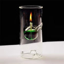 Lámpara de aceite de vidrio borosilicato 15 cm encendida en mesa, luz cálida decorativa