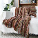Manta boho para sofá em tricô com franjas e caimento elegante no sofá