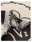 Manta cubre sofá tejido jacquard con textura y terminación de flecos en el borde