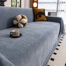 Manta cubre sofá jacquard espiga azul con flecos en living moderno