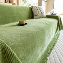Manta cubre sofá jacquard espiga verde con flecos en living cálido