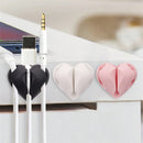 Organizador de cables con forma de corazón para mesa de luz, evita cables caídos