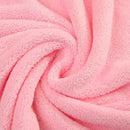 Detalle del tejido suave y absorbente de toalla con capucha para bebé de piel delicada